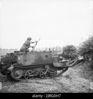 The British Army in the United Kingdom 1939-45 A reconnaissance regiment soldier fires a 2-inch mortar from a Universal carrier, 10 May 1943. Stock Photo