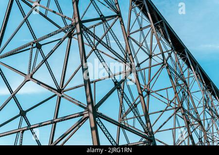 A tall train bridge viaduct engineered with iron steel trusses and beams for a strong structure Stock Photo