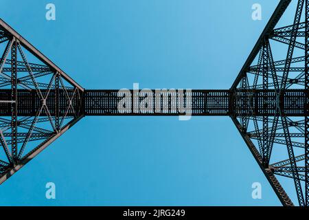 A tall train bridge viaduct engineered with iron steel trusses and beams for a strong structure Stock Photo