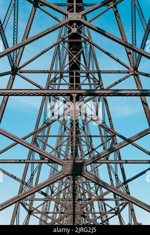 A tall train bridge viaduct engineered with iron steel trusses and beams for a strong structure Stock Photo