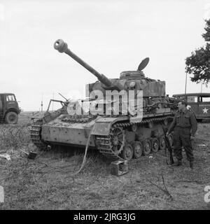 A captured German PzKpfw IV tank at 27th Armoured Brigade workshops ...