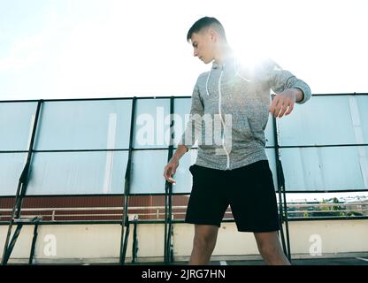 Rider on waveboard plays in abandoned parking lot Stock Photo