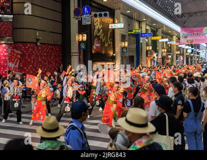 Kochi, Japan - August 10, 2022: Energetic dancers in shopping arcade during summer Yosakoi Festival Stock Photo