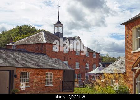 Whitchurch Silk Mill on the River Test in Hampshire is an industrial museum and working 19th century water mill that weaves silk fabrics Stock Photo