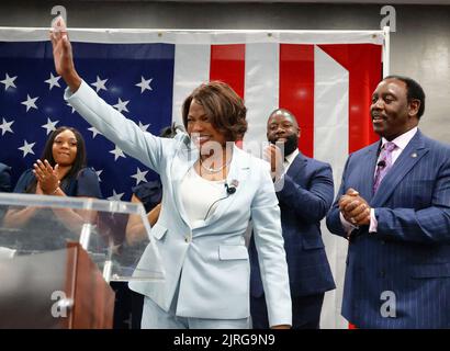 Orlando, USA. 24th Aug, 2022. Val Demings, Democratic candidate for the U.S. Senate, resonds to cheering supporters with her spouse, Orange, Florida, mayor Jerry Demings, far right, and her family at her election night party at Camping World Stadium in Orlando on Tuesday, Aug. 23, 2022. (Photo by Joe Burbank/Orlando Sentinel/TNS/Sipa USA) Credit: Sipa USA/Alamy Live News Stock Photo