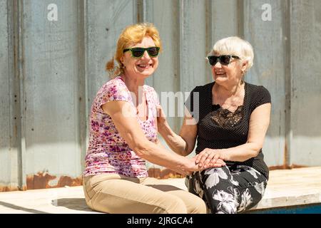 Two elderly women are happy to meet each other Stock Photo - Alamy