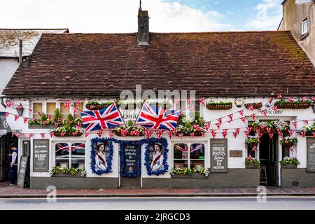 Flags and Portraits Of The Queen Adorn The Front Of The Old Black Horse Pub During The Queen's Platinum Jubilee Celebrations, Rottingdean, Sussex, UK. Stock Photo