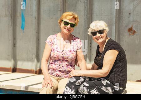 Two elderly women are happy to meet each other Stock Photo