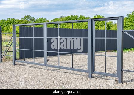 Installation of metal gates. Stock Photo