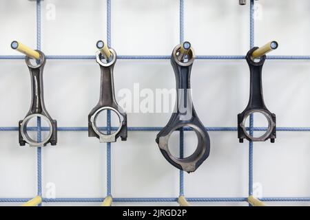 connecting rod on the wall, different models, close up Stock Photo