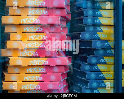 Pizza boxes stacked on top of each other colourful card boxes Stock Photo