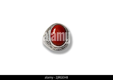 men spiritual stone ring isolated on white macro focus blurry background red coral gemstone closeup Stock Photo