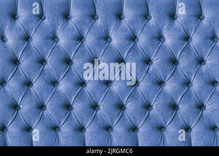 Blue capitone checkered soft fabric textile decorative background with buttons. Classic retro Chesterfield style, luxurious upholstery buttoned textur Stock Photo