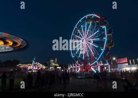 The Wonder Shows midway illuminated at night at the Harvest Festival in Winkler, Manitoba, Canada. Stock Photo