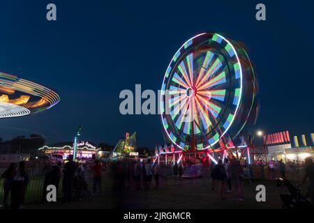 The Wonder Shows midway illuminated at night at the Harvest Festival in Winkler, Manitoba, Canada. Stock Photo