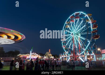 The Wonder Shows midway illuminated at night at the Harvest Festival in Winkler, Manitoba, Canada. Stock Photo