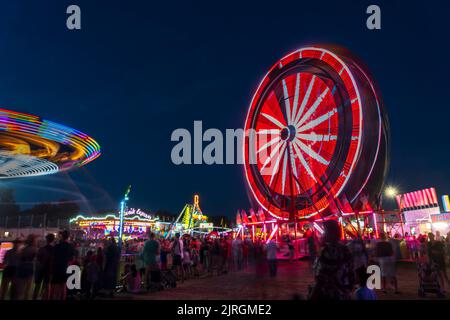 The Wonder Shows midway illuminated at night at the Harvest Festival in Winkler, Manitoba, Canada. Stock Photo