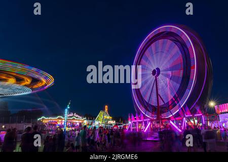 The Wonder Shows midway illuminated at night at the Harvest Festival in Winkler, Manitoba, Canada. Stock Photo