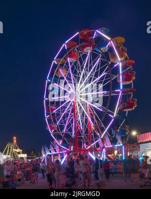 The Wonder Shows midway illuminated at night at the Harvest Festival in Winkler, Manitoba, Canada. Stock Photo