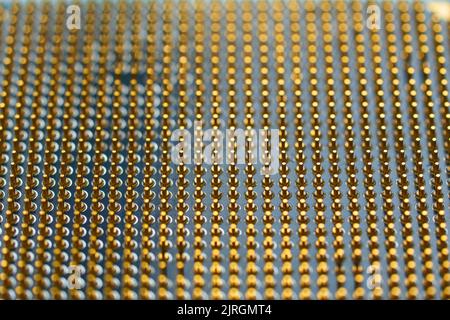 Microprocessor on white background. golden pins facing up. The concept of new technologies Stock Photo