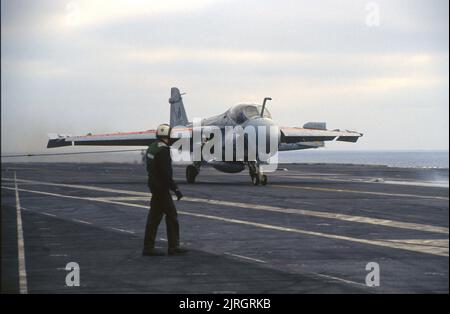 Grumman A-6 Intruder comes to a stop after catching three-wire Stock Photo