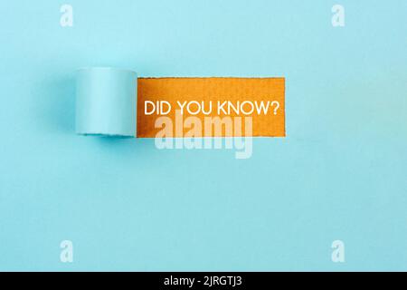 Did you know? text on torn paper blue background Stock Photo