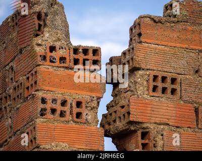 vertical Brick Wall With Crack. Engineering concept and disaster Stock Photo