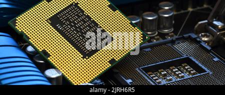 Detail of CPU Chip over socket of a modern computer motherboard. Electronic small component details. long banner web image Stock Photo