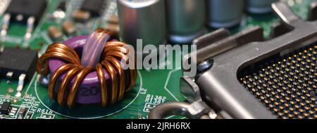 detail of electronic components over computer mainboard. long banner web image Stock Photo