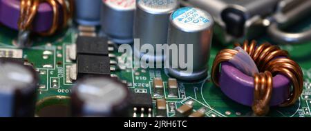detail of electronic components over computer mainboard. long banner web image Stock Photo