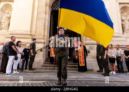 The coffin is assisted out of the church as crowds attend a funeral of a serviceman, killed by the Russian army in Saint Peter and Paul Cathedral in the old town of Lviv on August 24. Senior Lieutenant Mykhailo Gamkalo, was also associate professor of the Department of Tourism of Lviv University. The city of Lviv selected a separate slot of land in the cemetery for the soldiers fallen in the fight with Russia, the soldiers are highly regarded as national heroes. Ukrainians celebrate Independence Day, as well as mark 6 month of war with Russia on August 24. (Photo by Dominika Zarzycka/Sipa US Stock Photo