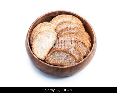 Wheat  bread sweet crouton crackers in wooden bowl isolated on white Stock Photo