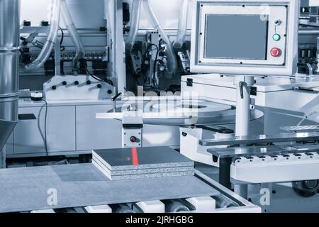Machine tools format cutting are cut chipboard furniture Stock Photo