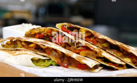 mexican quesadilla sandwich, saute vegetables wrapped with tortilla bread Stock Photo