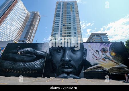 Los Angeles, California, USA. 24th Aug, 2022. A mural depicting Kobe Bryant and his daughter, Gianna, is seen in Los Angeles, Wednesday, August 24, 2022. To mark Mamba Day 2022, a 125 feet by 32 feet giant outdoor mural depicting a close-up of Kobe Bryant's face, in black-and-white, in the middle, flanked by a mamba snake on the left and, in color, a group of children including Bryant's daughter Gianna playing basketball atop a giant book, is unveiled on an entire side of a building near former Staples Center. (Credit Image: © Ringo Chiu/ZUMA Press Wire) Stock Photo