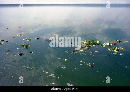 May 6, 1990, Botosani County, Romania. The Bridge of Flowers (Podul de Flori) event along the Prut River, that separated Romania and the Moldavian Socialist Republic. People were allowed for the first time since WWII to cross the border to their 'brothers' without a passport or visa. Flowers were symbolically thrown on the water. Stock Photo