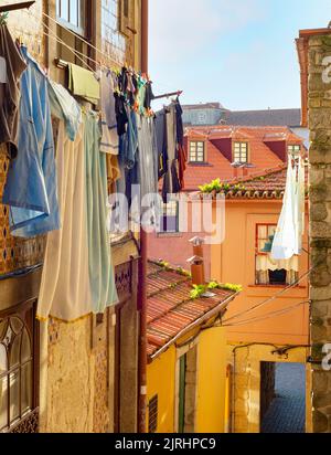 Clothes drying on line, traditional old town street view, colorful houses, Porto, Portugal Stock Photo