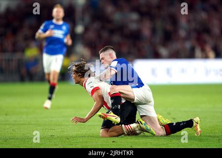 PSV Eindhoven's Xavi Simons (left) tackles Rangers' Ryan Kent during the UEFA Champions League qualifying match at PSV Stadion, Eindhoven. Picture date: Wednesday August 24, 2022. Stock Photo