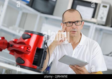 portrait of man reading instruction Stock Photo