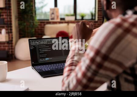 Diverse freelance coders programming html script at home, using encryption and program code to develop new user interface. Learning online app security firewall on terminal window, coding server. Stock Photo