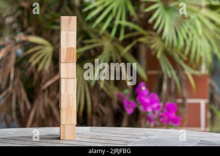 Eight blank wooden block cubes. On nature and green leaf background ...
