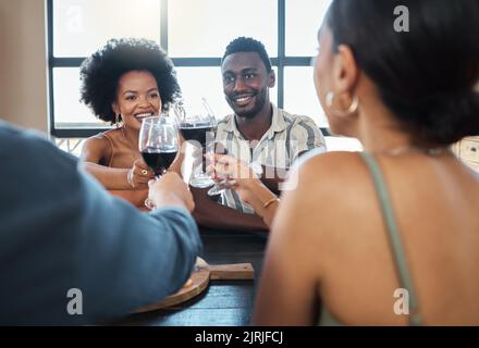 Friends, wine and food of couples having dinner together or double date, drinking wine at a restaurant. Romantic group at a restaurant having fun and Stock Photo