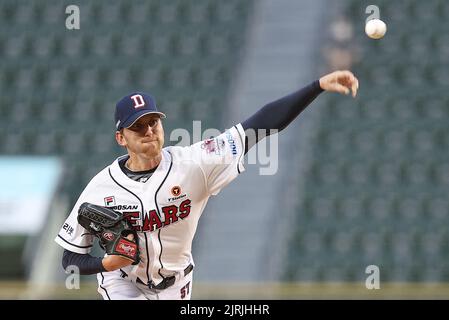 IU throws the opening pitch for the Doosan Bears