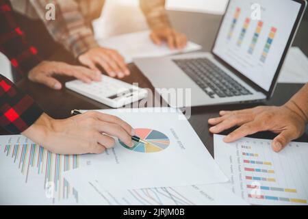 Businessmen together analyze charts and graphs. Team work to be successful. Business growth, business strategy. Stock Photo