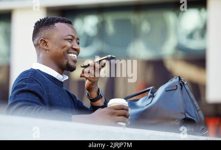 Happy black man talking on phone, travel for business in a city, sitting outside while using tech to communicate. Carefree African American planning Stock Photo