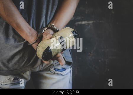 The drug dealer was arrested with handcuffs and hands on his back. Stock Photo