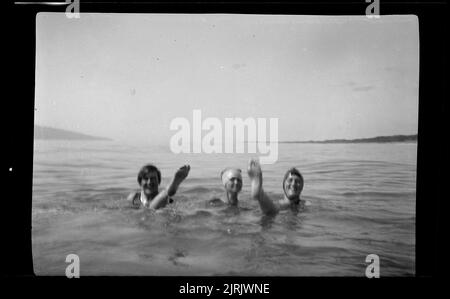 [Women swimming at the beach], 1920s to 1930s, by Roland Searle. Stock Photo