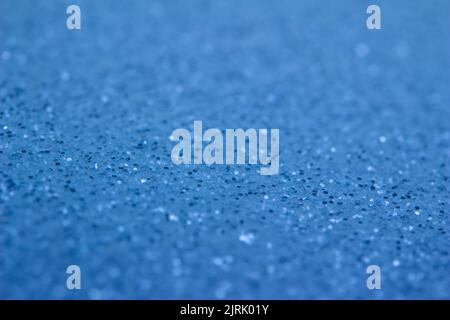 Full frame abstract texture of shimmering blue glitter background with selective focus Stock Photo
