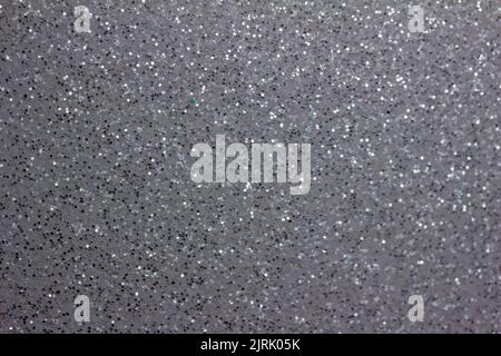 Full frame abstract texture of shimmering silver glitter background with selective focus Stock Photo