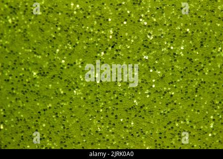 Full frame abstract texture of shimmering green glitter background with selective focus Stock Photo